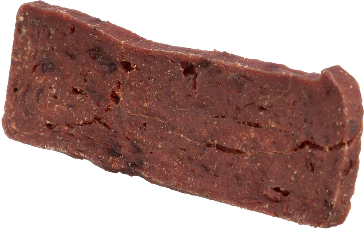 Ein rechteckiges, dickes, dunkelbraunes Stück mit rauer Textur und ungleichmäßiger Oberfläche.