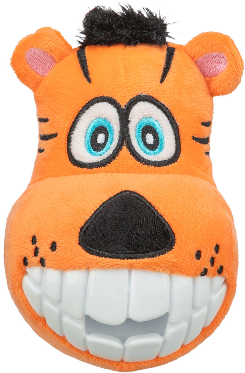 Oranges, plüschiges Spielzeug mit großen weißen Zähnen und blauen Augen auf schwarzem Hintergrund.