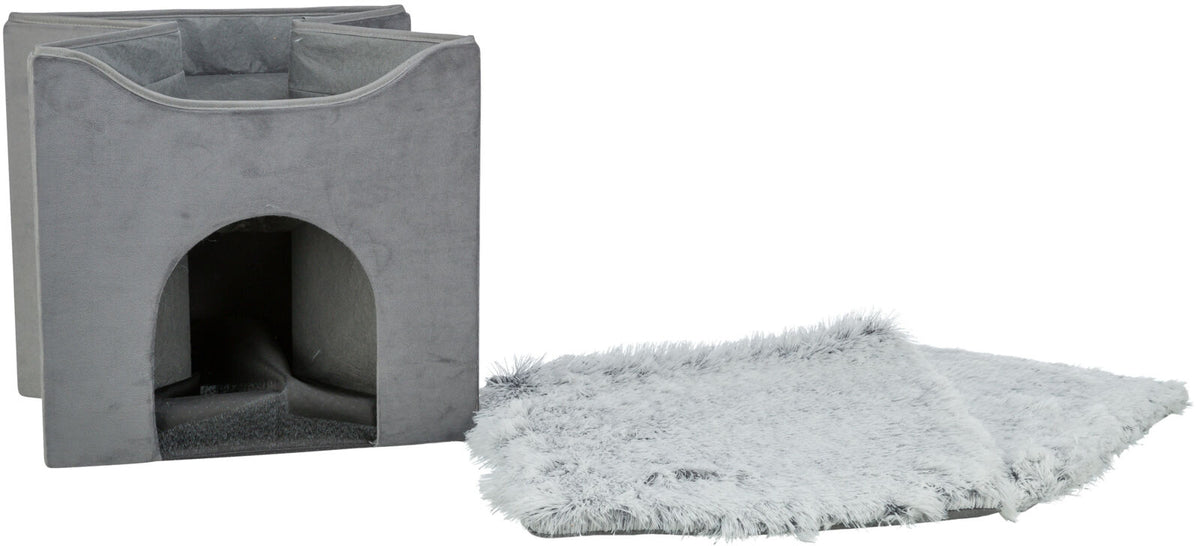 Graue quadratische Höhle mit offenem Eingang und daneben liegendem flauschigen, grauen Kissen.