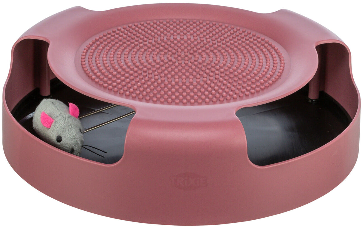 Rundes, rosafarbenes Katzenspielzeug mit Löchern und einer grauen Plüschmaus innen.