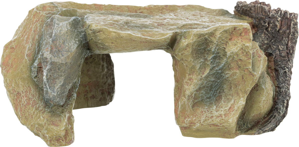 Steinähnliche Dekoration mit brauner und grauer Struktur, Form erinnert an kleine Höhle oder Felsvorsprung.