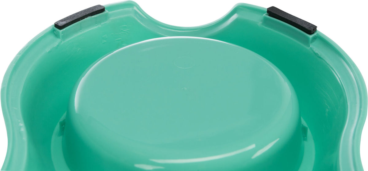 Grüne Plastikschale mit abgerundeten Kanten und zwei schwarzen rutschfesten Pads am Rand.