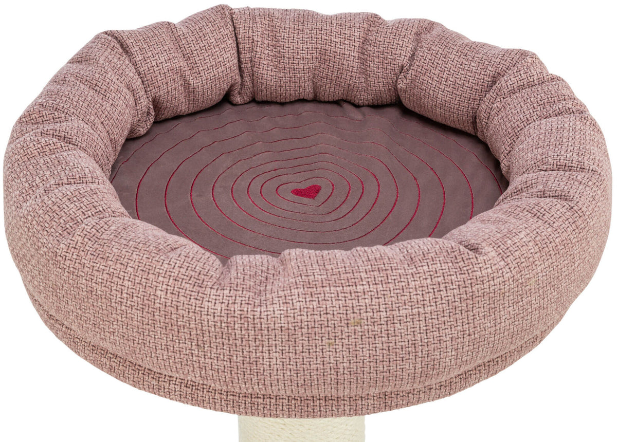 Rundes, gepolstertes Sitzkissen in hellbraunem Stoff mit rosa Herzmuster in der Mitte.