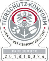 Rundes Siegel mit Adler und Pfotenabdrücken, Text "TIERSCHUTZKONFORM" und Prüfnummer 201810024.