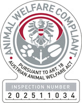 Rundes Siegel mit Adler, Tatzenabdrücken und Text "ANIMAL WELFARE COMPLIANT" sowie "INSPECTION NUMBER 202511034".
