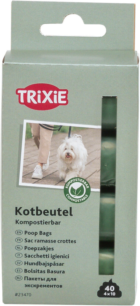 Grüne Verpackung kompostierbarer Kotbeutel mit Markenlogo, Bild eines Hundes, und Übersetzungen in mehreren Sprachen.