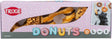 Hundeleckerli in Donutform in bunter Verpackung mit Logo "Trixie" und Bild eines Hundes, der Donut frisst.
