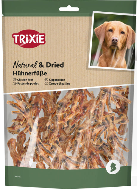 Verpackung von Trixie getrockneten Hühnerfüßen für Hunde mit Abbildung eines Hundes, braune Hühnerfüße sichtbar.