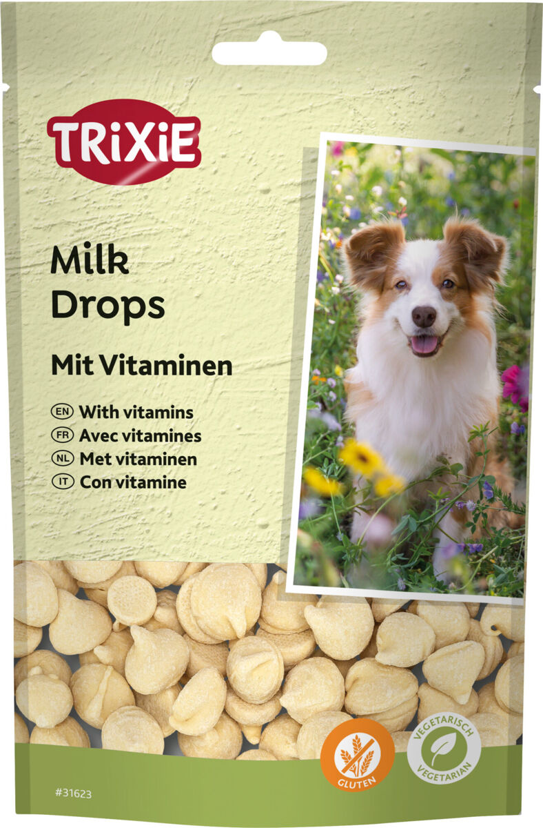 Verpackung von Trixie Milk Drops mit Vitaminen, glutenfrei und vegetarisch, zeigt Hund auf der Vorderseite, beige Drops sichtbar.