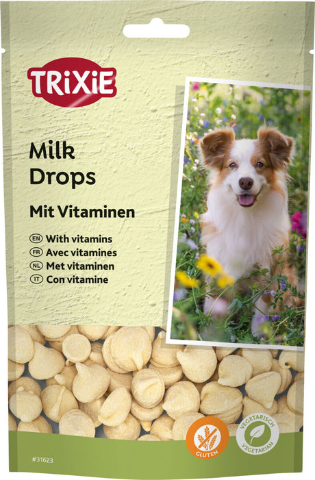 Verpackung von Trixie Milk Drops mit Vitaminen, glutenfrei und vegetarisch, zeigt Hund auf der Vorderseite, beige Drops sichtbar.