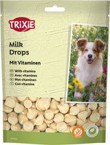 Verpackung von Trixie Milk Drops mit Vitaminen, zeigt einen Hund und beschreibt glutenfreies und vegetarisches Produkt.