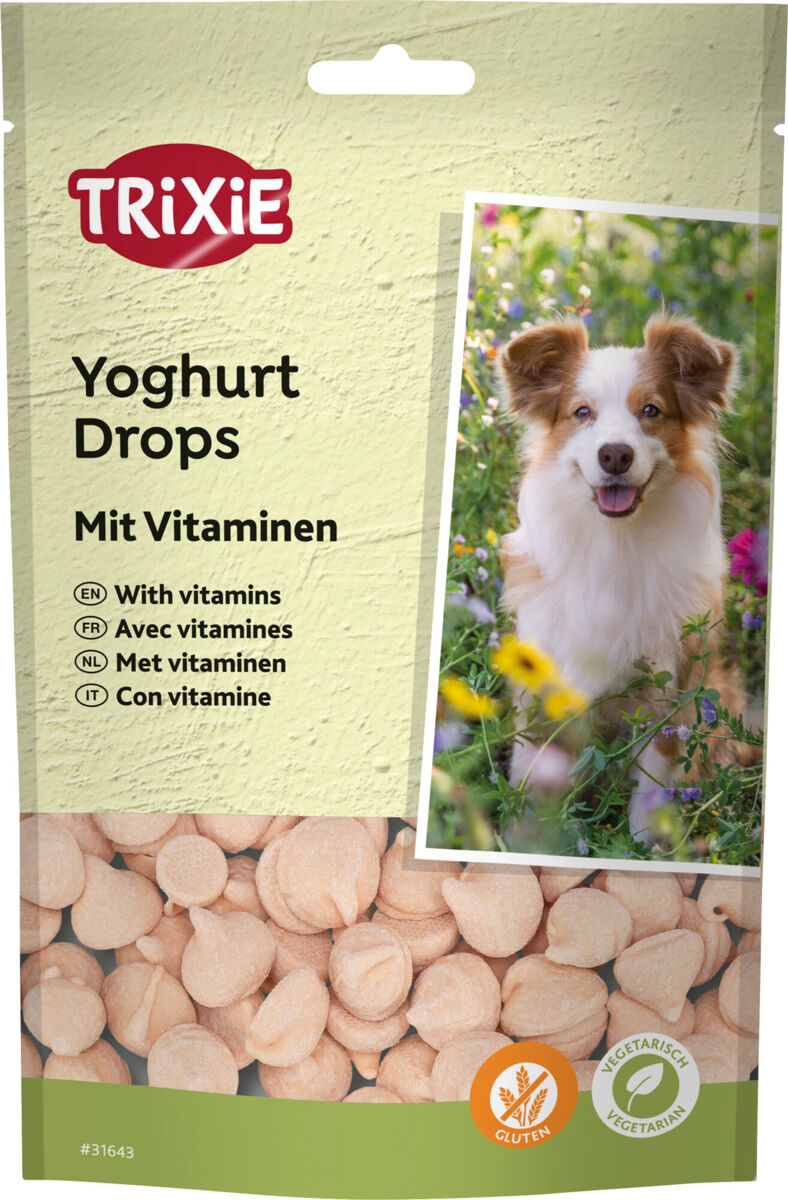 Verpackung von Trixie Yoghurt Drops mit Vitaminen, darunter ein Foto eines Hundes im Garten und Abbildung der Drops.
