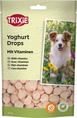 Verpackung von Trixie Yoghurt Drops mit Vitaminen, darunter ein Foto eines Hundes im Garten und Abbildung der Drops.