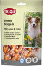 Verpackung von Trixie Snack Bagels mit Lamm und Huhn, Bild eines Hundes und Bagels, Text in mehreren Sprachen.