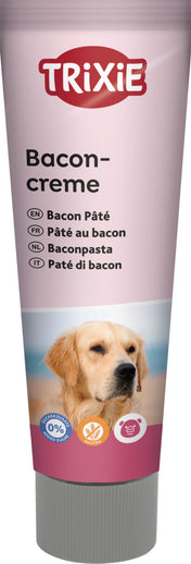 Eine rosa Tube mit der Aufschrift "Baconcreme" und verschiedenen Sprachen, darunter ein Bild eines Hundes.