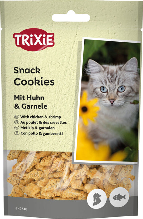 Verpackung von Katzensnacks mit Huhn und Garnele, Markenname Trixie, Bild einer Katze, gelbe Blüten im Hintergrund.
