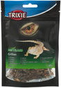 Verpackung mit getrockneten Grillen von Trixie, oben ein Bild eines Reptilienauges und einer Echse auf schwarzem Hintergrund.