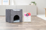 Graue Höhle mit flauschigem Innenbereich und PETA Vegan Award auf Holzboden.