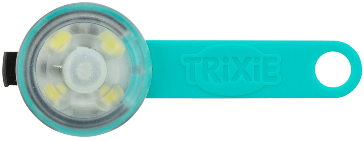 Rundes, transparentes Leuchtartikel mit blauer Halterung, Aufschrift "TRIXIE", vier gelbe LEDs sind sichtbar.