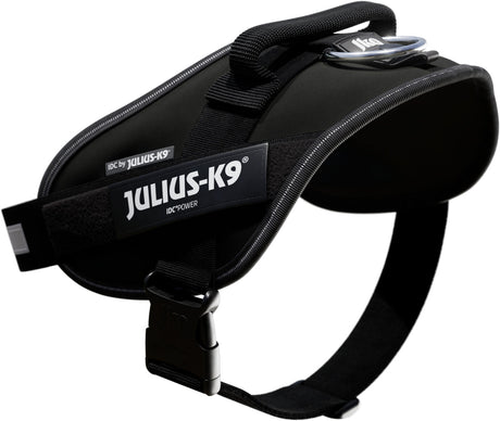 Schwarzes Hundegeschirr mit verstärktem Griff und sichtbarem "Julius-K9" Logo, seitlich abgebildet.
