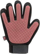 Ein schwarzer und rosafarbener Tierpflegehandschuh mit Noppen und Klettverschluss.