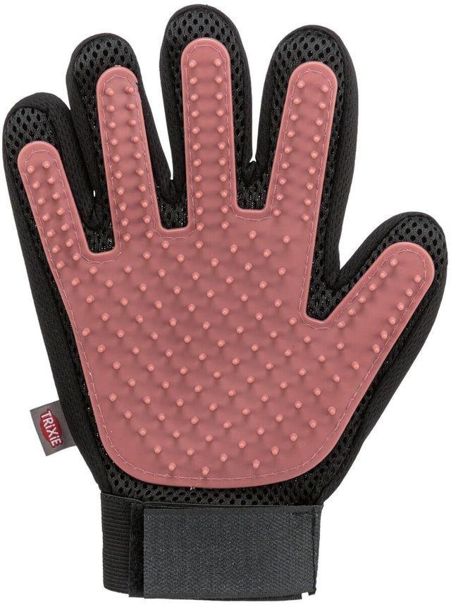 Ein schwarzer und rosafarbener Tierpflegehandschuh mit Noppen und Klettverschluss.