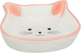 Keramikschale in Katzenkopfform mit rosa Rand und Katzengesicht auf dem Boden, schlichtes Design.