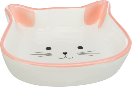 Keramikschale in Katzenkopfform mit rosa Rand und Katzengesicht auf dem Boden, schlichtes Design.