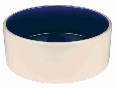 Keramikschüssel in Cremefarbe mit dunkelblauer Innenfläche, zylindrische Form, keine weiteren Details sichtbar.