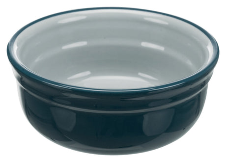 Runde Schüssel aus glänzendem, dunkelblauem Material mit hellem Inneren.