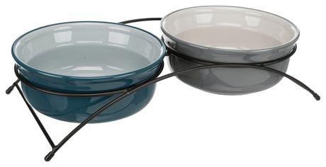 Zwei runde Schalen in Blau und Grau, auf einer schwarzen Metallhalterung sitzend, vor weißem Hintergrund.