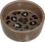Braune Schale mit einem Leopardenmuster im Inneren, das schwarze und braune Flecken aufweist.