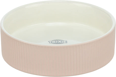 Runde, rosa Schale mit geriffelter Oberfläche und weißem Innenbereich, Marke "Trixie" sichtbar innen.