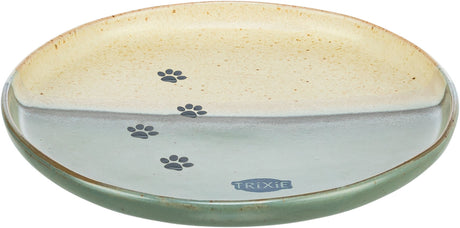 Runder, zweifarbiger Napf in Beige und Grün mit Pfotenabdrücken und dem Aufdruck "Trixie".