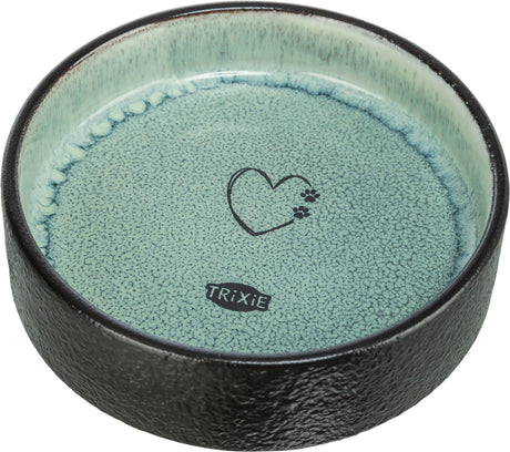Runde Schale mit schwarzem Rand und hellblauem Innenbereich samt Herz- und Pfotenmotiv sowie "Trixie"-Logo.