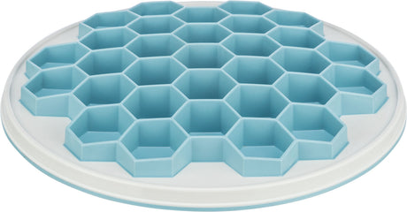 Runde, flache, weiße Kunststoffplatte mit blauem sechseckigem Muster auf der Oberseite.