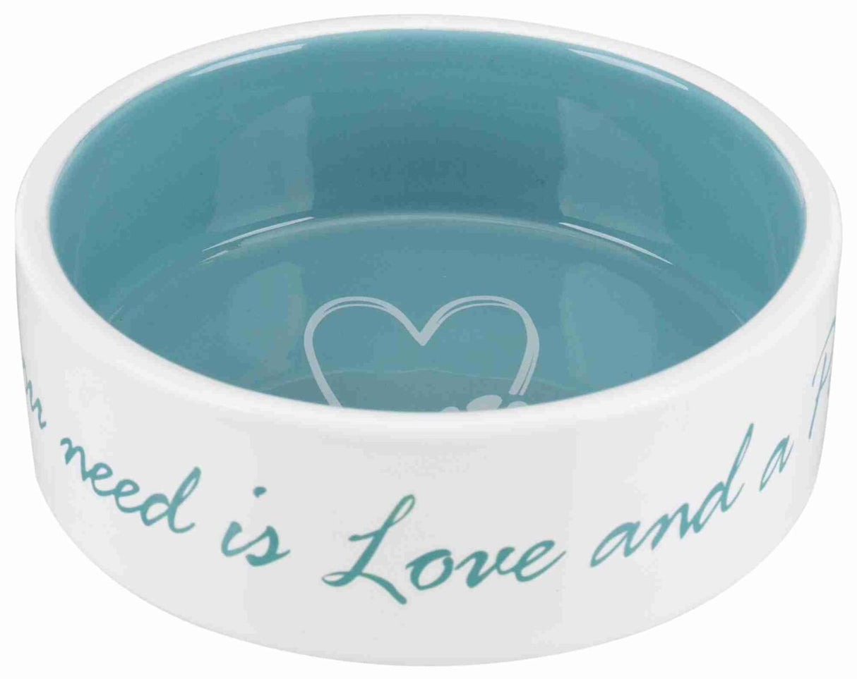 Weiße Keramikschüssel mit blauem Inneren und der Aufschrift "All you need is Love and a".