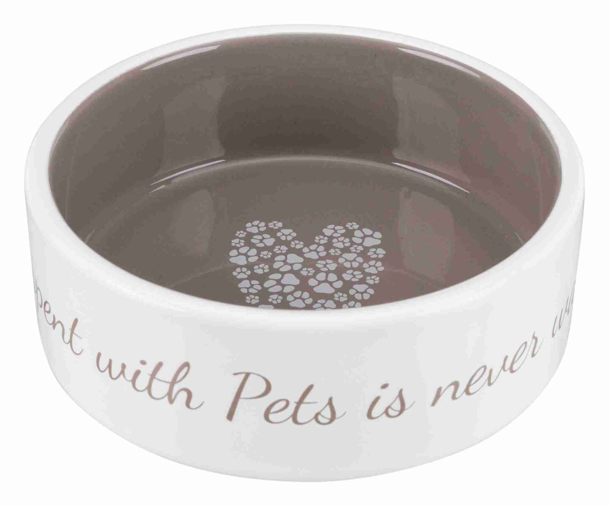 Weiße Keramikschüssel mit grauem Innenraum, Pfotenherz in der Mitte, Aufschrift außen "Time spent with Pets is never wasted."