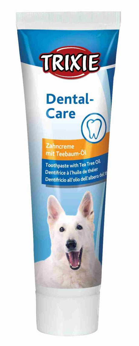 Zahnpasta-Verpackung mit Hundeabbildung, Text "TRIXIE Dental-Care Zahnpasta mit Teebaum-Öl" auf blauem Hintergrund.