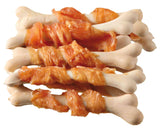 Weiße Knochen mit orange eingefärbten, fleischartigen Streifen auf einem weißen Hintergrund.