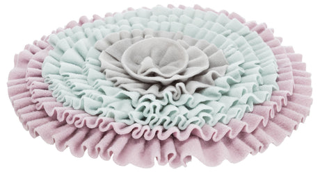 Runde, mehrschichtige, weiche Stoffmatte in Rosa, Hellblau und Grau mit rüschenartigen Strukturen.