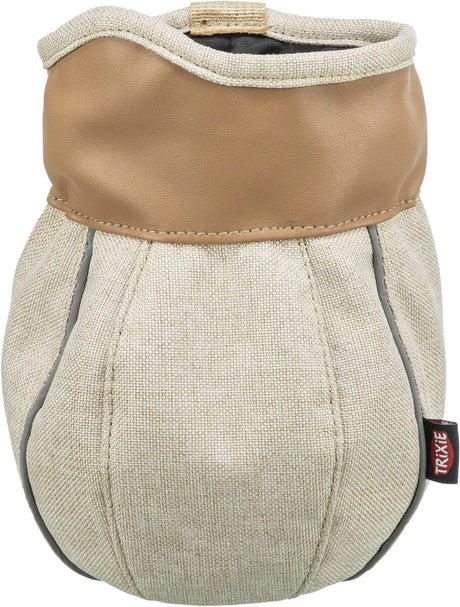 Zylinderförmiger, beige-brauner Behälter mit Textilstruktur und Markenetikett.