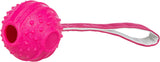 Pinkfarbener Ball mit strukturierten Noppen und daran befestigtem pinkem Band mit weißer Kante.