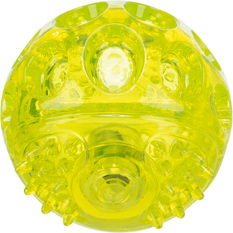 Gelber, transparent glänzender Ball mit Noppen und strukturierten Oberflächen, glatt und rund.
