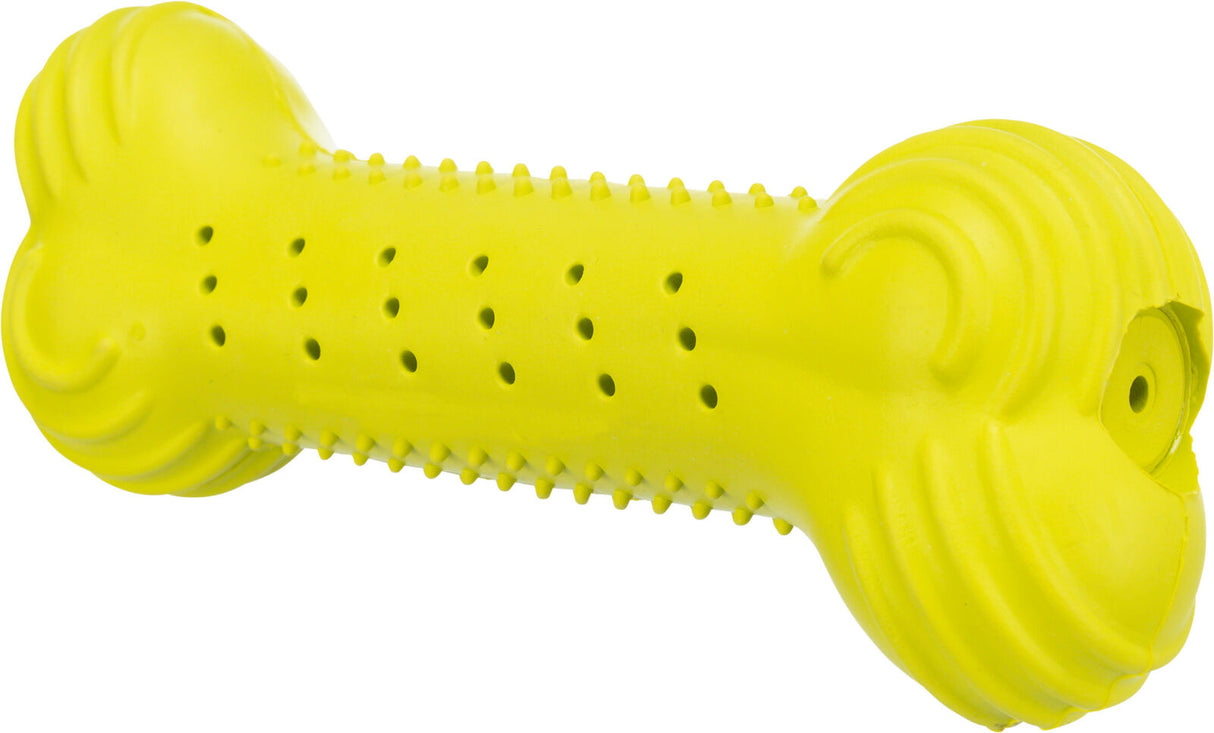 Gelbes Spielzeug in Knochenform mit Noppen und Löchern entlang der Oberfläche.