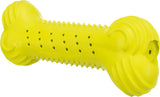 Gelbes Spielzeug in Knochenform mit Noppen und Löchern entlang der Oberfläche.