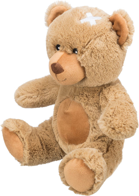 Ein sitzender, brauner Teddybär aus Plüsch mit hellbraunem Gesicht, Bauch und Pfoten, sowie einem weißen Kreuz auf der Stirn.
