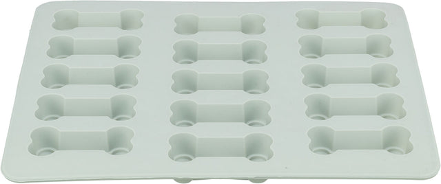 Weiße Silikonform mit sechzehn knochenförmigen Vertiefungen auf einer flachen Oberfläche.