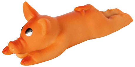 Orange Kunststoffspielzeug in Form eines liegenden Schweins mit großen, schwarzen Augen.