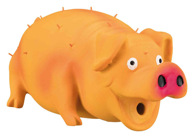Ein orangefarbenes, schweinähnliches Spielzeug mit rosaner Schnauze und aufgerissenen Augen, zeigt eine lächelnde Mimik.